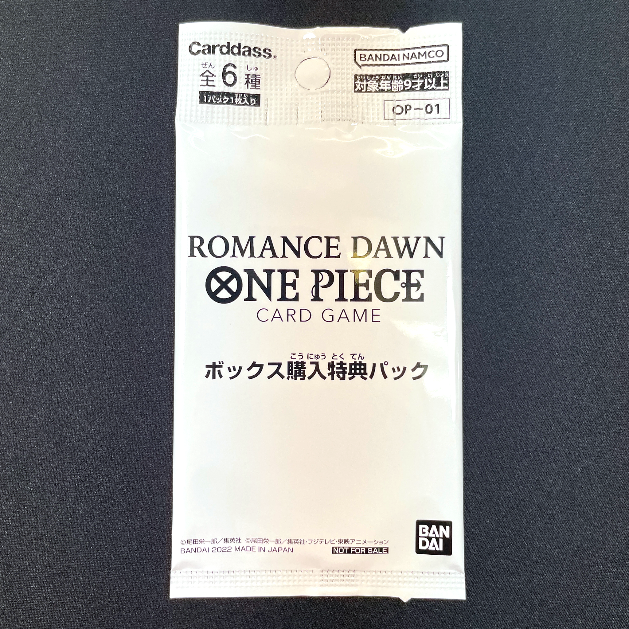 ONE PIECE CARD GAME ｢ROMANCE DAWN｣  ONE PIECE CARD GAME OP01 Box Kounyuu Tokuten Pack  The pack contains one OP01 parallel card among 6 different ones.  The card can be:      OP01-008 Parallel     OP01-034 Parallel     OP01-048 Parallel     OP01-064 Parallel     OP01-077 Parallel     OP01-109 Parallel